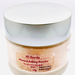 Mineral setting powder jar with silver lid and beige label, NC Beauty branding visible