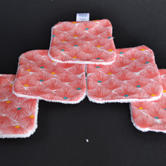 Reusable facial pads with red floral pattern, white trim, and "Made in Avegrom France" tag