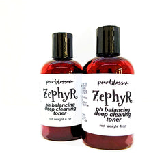 Toner bottles with red liquid, black cap, and white label with Zephyr text