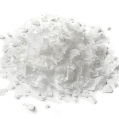 Flaked salt crystals, white, irregular shape, pile on white background