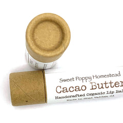 Lip balm tubes, brown cardboard material, Sweet Poppy Homestead branding visible