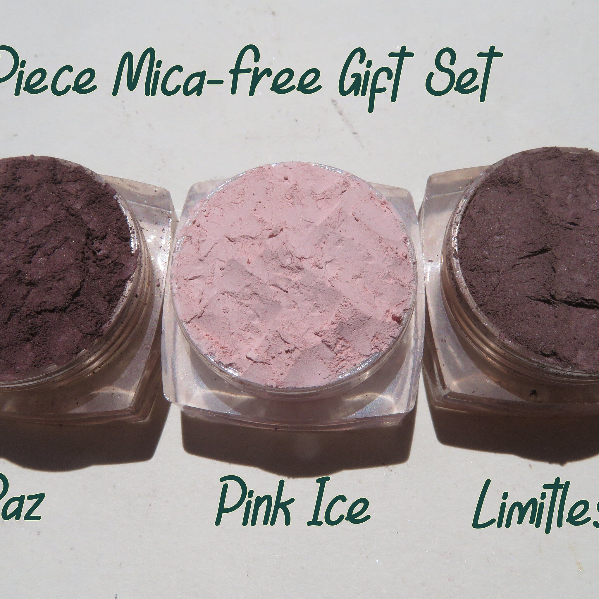 Three small jars of vegan matte mineral eyeshadow in loose powder form, displayed on a neutral background.