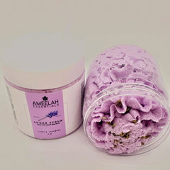 Sugar scrub in lavender color with clear plastic container and Ameelah Essentials label visible
