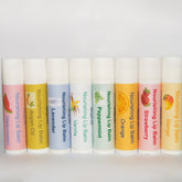 Lip balms with assorted colors, MorganEK brand name, and fruit illustrations on labels