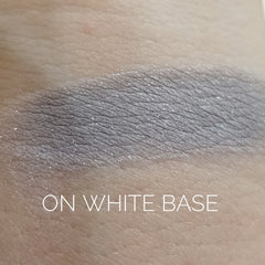 Close-up of Ghost Eye Shadow pan showing smooth matte finish and cool-toned lavender pigment