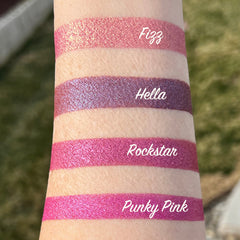 Close-up of Rockstar vegan eyeshadow pan showing rich metallic silver and charcoal swirls in pressed powder