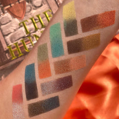 Eyeshadow swatches with various colors including green, orange, and brown, shown on arm