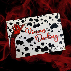 Dalmatian print background with red text and hand holding cigarette holder, Prolux brand