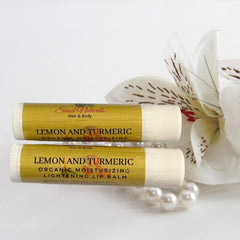 Lip balm tubes with yellow and white labels, Sirod Naturals brand, with flower and pearls