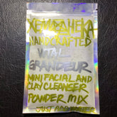 Facial cleanser powder mix in a clear, iridescent pouch with XemHeka text in yellow