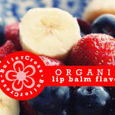 Lip balm flavor oil with red banner and fruit, Butter Cress logo visible, fruit slices