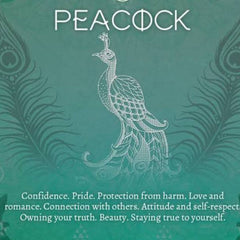 Side view of peacock-inspired eyeshadow palette showcasing vibrant blue and green shimmer shades in rectangular pans
