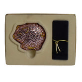 Face makeup compact with pink crystal pig, gold accents, and black velvet case