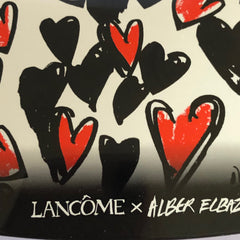 Side view of LANCÔME x Alber Elbaz blue and taupe eyeshadow palette showcasing textured compact design