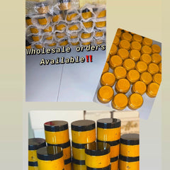 Golden turmeric and honey sugar scrub in a white jar with black label, showcasing natural skincare texture