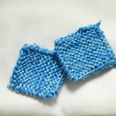 Makeup remover scrubby pads, blue and white knitted fabric, two square pads