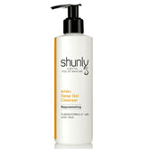 Facial Cleanser bottle, white with black pump, Shunly Skincare branding and orange accent stripe