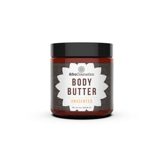 Hand scooping unscented whipped shea butter from a white jar, showcasing its creamy texture