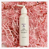 Face cleanser bottle, white plastic pump, pink shredded paper background, PRINCE & EVE text