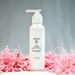 Face cleanser bottle with white plastic, pump top, and pink paper filler with Prince & Eve text