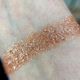 Front view of the Io Eye Shadow Palette showcasing a sleek black compact with six vibrant matte and shimmer shades