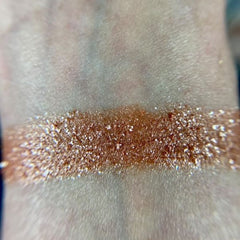 Close-up of Io Eye Shadow Palette showing six matte and shimmer shades in warm neutrals and rich burgundy tones