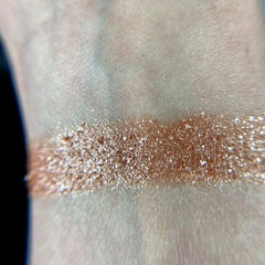 Side view of Io Eye Shadow Palette displaying matte and shimmer shades in warm bronze and taupe tones