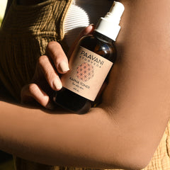 Kapha toner brown glass bottle with white spray top held by person with beige nails