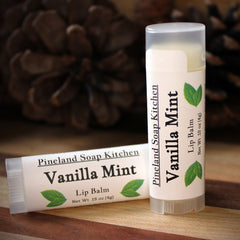 Lip balm tubes, white with text and green leaf design, Pineland Soap Kitchen brand