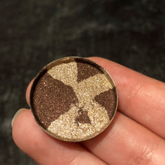 Close-up of Mercury Single Eye Shadow showing rich metallic silver pigment with smooth satin finish in compact case