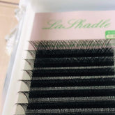False eyelashes, black synthetic material, curved style, LaShadle brand name visible