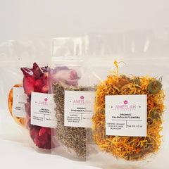 Organic rose petals in clear plastic bags, Ameelah Essentials branding visible, close up view