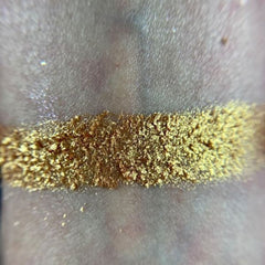 Side view of Harvest Moon palette showcasing six earthy matte and shimmer eyeshadows in bronze, taupe, and gold tones