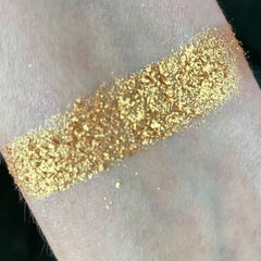 Harvest Moon Eye Shadow Palette featuring warm bronze, gold, and copper shades in a sleek black compact