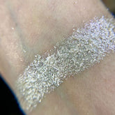 Front view of Iapetus Eye Shadow Palette showcasing twelve vibrant matte and shimmer shades in sleek black compact