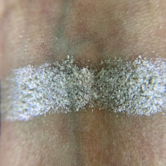 Side view of Iapetus Eye Shadow Palette showcasing shimmering bronze and matte taupe shades in sleek black compact