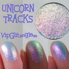 Side view of multichrome unicorn eyeshadow pan catching light with shifting blue-purple hues