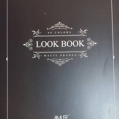 Look Book cover with black background, white text, and decorative flourishes, AMUSE brand