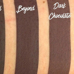 Dark brown swatch with Beyond and Dark Chocolate text, diagonal texture on skin