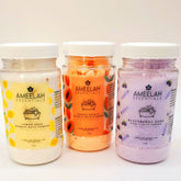 Bubble bath powder in clear plastic jars with white lids, Ameelah Essentials brand