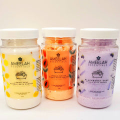 Bubble bath powder in clear plastic jars with white lids, Ameelah Essentials brand