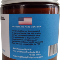 Brown jar with white lid and blue label with US flag, packaged in USA, product label visible