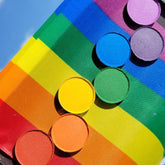 Rainbow Pride eyeshadow palette with seven vibrant matte shades in a sleek black compact