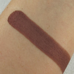 Brown eyeshadow swatch on skin, showing color and texture of product application