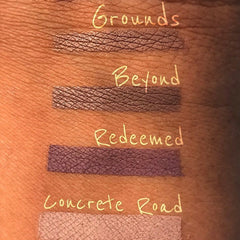 Lipstick swatches, various shades of brown, purple, and pink, textured finish, on skin