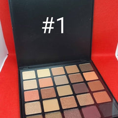 Close-up of 25 vibrant eyeshadow shades in matte, shimmer, and metallic finishes arranged in rectangular pans