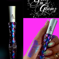 Liquid eyeshadow with iridescent purple and blue color, GlitznGlamz brand bottle, swatch on hand
