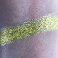 Eyeshadow swatch, lime green shimmer, textured application on skin
