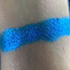 Side view of Atmosphere Eye Shadow Palette displaying twelve matte and shimmer shades in neutral tones with mirrored compact.