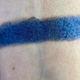 Helpless Eye Shadow Palette featuring 12 matte and shimmer shades in warm neutrals and bold jewel tones